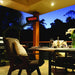 Installed in outdoor dining area on a wooden deck with furniture and a table set for a meal.
