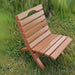 Camp Chair in a grassy outdoor setting - poly luxe - cedar
