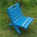 Camp Chair in a grassy outdoor setting - poly luxe - aruba blue