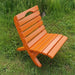 Camp Chair in a grassy outdoor setting - poly luxe - orange