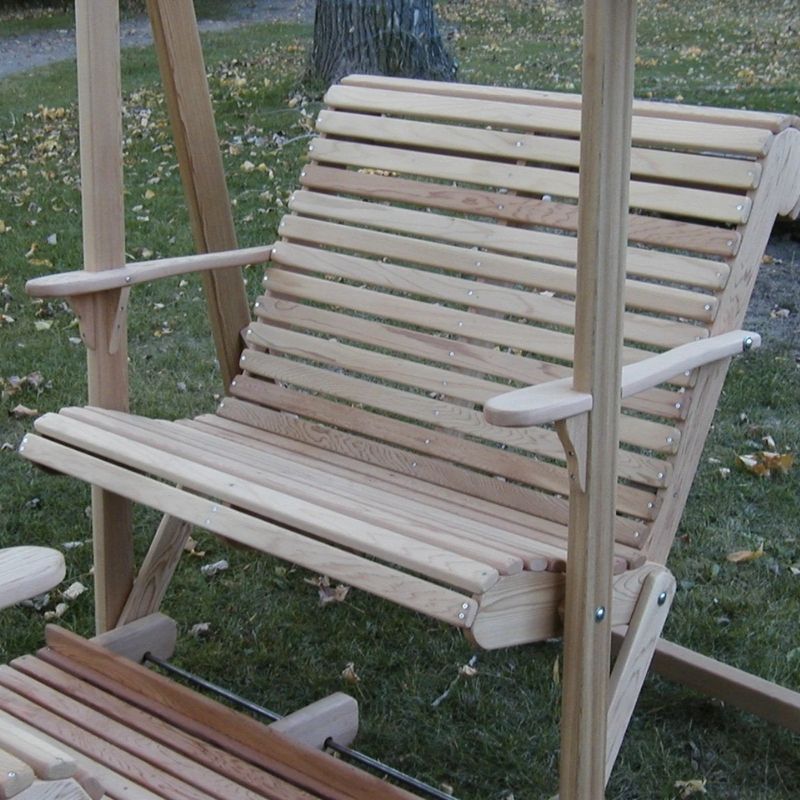 Wooden porch swing on a grassy background