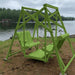 Lime green Classic Garden Swing set by a lake on a cloudy day