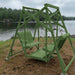 Turf green Classic Garden Swing set by a lake on a cloudy day