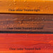Three types of clear cedar treated wood with different colors and finishes.