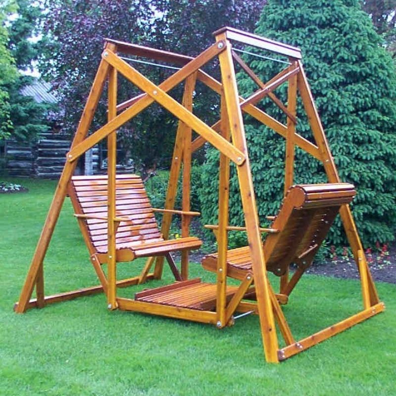 Classic graden swing set with two seats on a grassy area