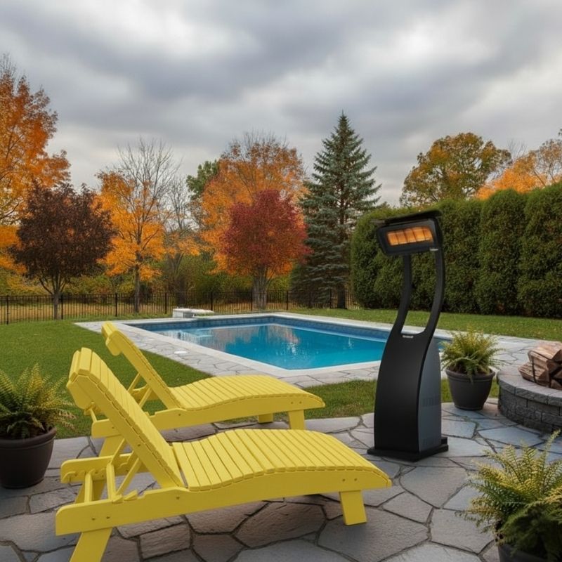 Yellow lounge chairs by a pool with a patio heater on a cloudy day.