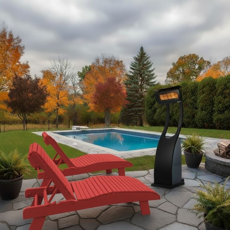 Red lounge chairs by a pool with a patio heater on a cloudy day.