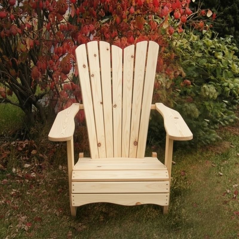 Wooden Adirondack chair on a patio with greenery in the background -wave back