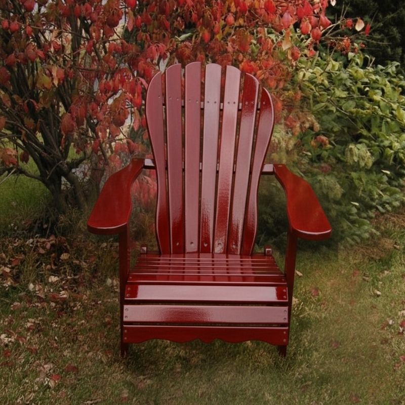 Wooden Adirondack chair on a patio with greenery in the background - sandal back  mahogamy glossy - clear cedar