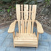 Wooden Adirondack chair on a patio with greenery in the background - puddle back