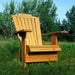 Wooden Adirondack chair on a patio with greenery in the background - golden glossy - clear cedar