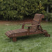 Deluxe Lounge Chair on grass with green bushes in the background - poly luxe - woodgrain brazilian walnut