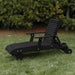 Deluxe Lounge Chair on grass with green bushes in the background - poly luxe - black