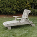 Deluxe Lounge Chair on grass with green bushes in the background - poly luxe - woodgrain driftwood grey