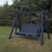 Patriot blue Family Porch Swing with Frame set on grass with trees in the background