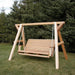 Family Porch Swing with Frame on grass with trees in the background