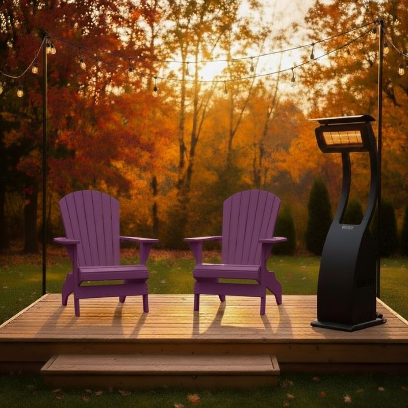 Two purple Adirondack chairs on a wooden deck with a patio heater, surrounded by autumn trees.