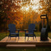 Two patriot blue Adirondack chairs on a wooden deck with a heater during autumn.
