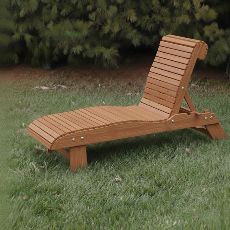 Lounge Chair on grass with trees in the background - poly luxe - cedar