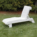 Lounge Chair on grass with trees in the background - poly luxe - white