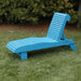 Lounge Chair on grass with trees in the background - poly luxe - aruba blue