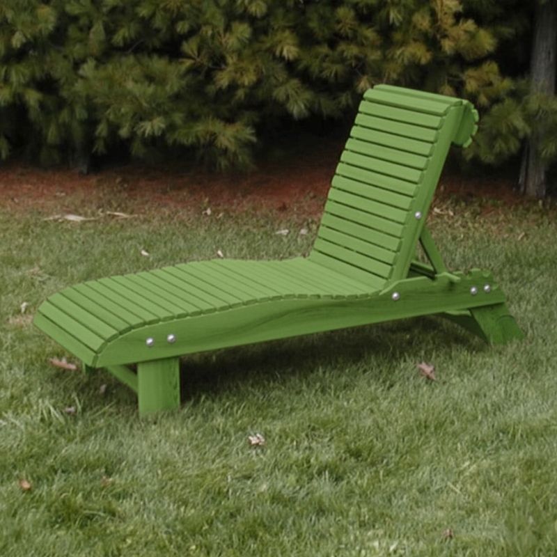 Lounge Chair on grass with trees in the background - poly luxe - lime green