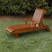 Lounge Chair on grass with trees in the background - clear cedar - caramel glossy