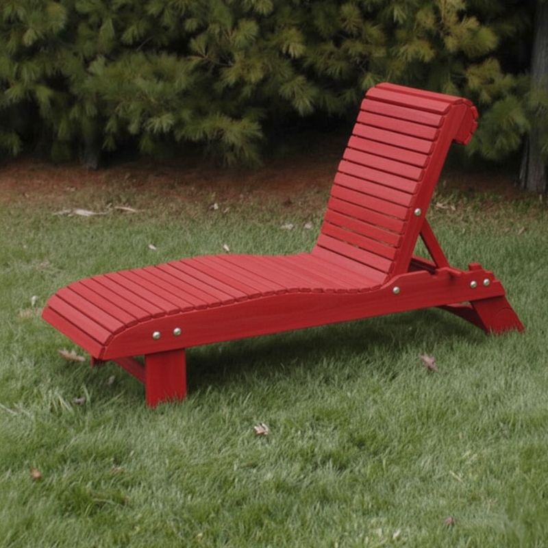 Lounge Chair on grass with trees in the background - poly luxe - red