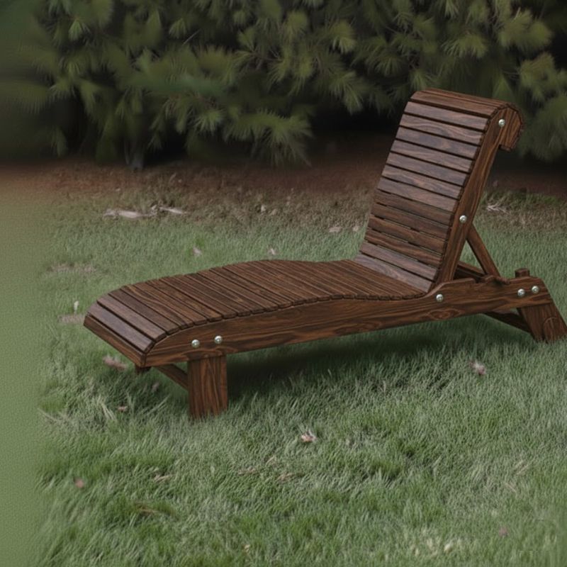 Lounge Chair on grass with trees in the background - poly luxe - woodgrain brazilian walnut