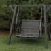 Lovers Porch Swing with Frame Dark Grey Variant in outdoor set up, with grass and trees.