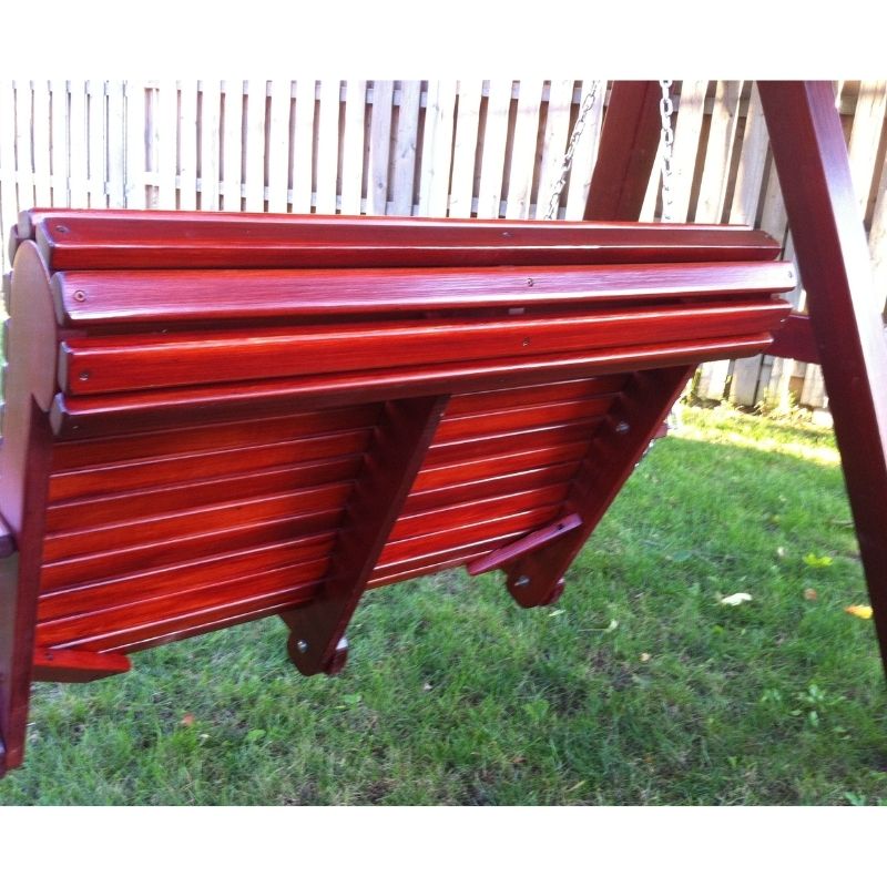 Lovers Porch Swing with Frame set on grass with wooden fence in the background