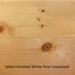 Close-up of select knotted white pine wood with natural grain and texture.