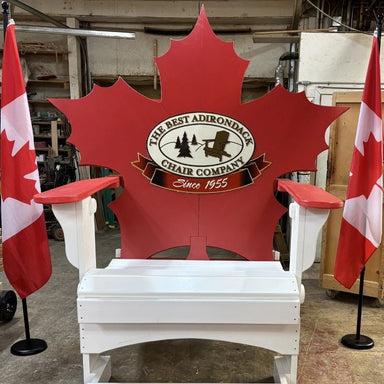 Maple Leaf Giant Chair with 'The Best Adirondack Chair Company' logo, surrounded by Canadian flags.