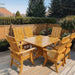 Modern Dining Set for 6 with Pedestal Table on a deck - knotted cedar - golden glossy