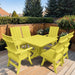 Modern Dining Set for 6 with Pedestal Table on a deck surrounded by greenery - poly luxe - lemon yellow