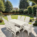 Modern Dining Set for 8 with 6' Table on a patio with a garden and house in the background - White