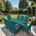 Modern Dining Set for 8 with 6' Table on a patio with a garden and house in the background - Aruba Blue