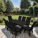 Modern Dining Set for 8 with 6' Table on a patio with a garden and house in the background - Black