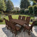 Modern Dining Set for 8 with 6' Table on a patio with a garden and house in the background - brazilian walnut