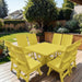 Modern Dining Set for 8 with Pedestal Table on a deck with a garden and house in the background - poly luxe - lemon yellow