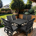 Modern Dining Set for 8 with Pedestal Table on a deck with a garden and house in the background - poly luxe - black