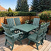 Modern Dining Set for 6 with Pedestal Table on a deck surrounded by greenery - poly luxe - turf green