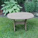 Oval Side Table in a grassy area with plants in the background - poly luxe - woodgrain driftwood grey