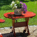 Adirondack chairs with side table outside