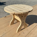 Round Side Table on a wooden deck with a concrete background - knotted cedar - unstained