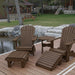 Royal Complete Patio Set on a wooden deck by a pond with a cabin in the background - poly luxe - woodgrain brazilian walnut