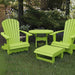 Lime green Royal Patio Set set on grass with a tree and water in the background