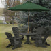 Dark grey Royal Picnic Set for 4 under a green umbrella, set against a backdrop of trees and grass.