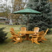 Royal Picnic Set for 6 under a green umbrella in a garden setting - knotted cedar - golden glossy