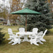 White Royal Picnic Set for 6 with a green umbrella on a grassy area with trees in the background.